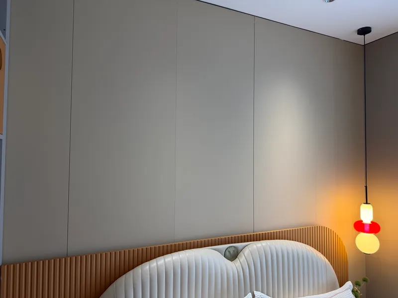 Installed flat panels above a fluted oak headboard band